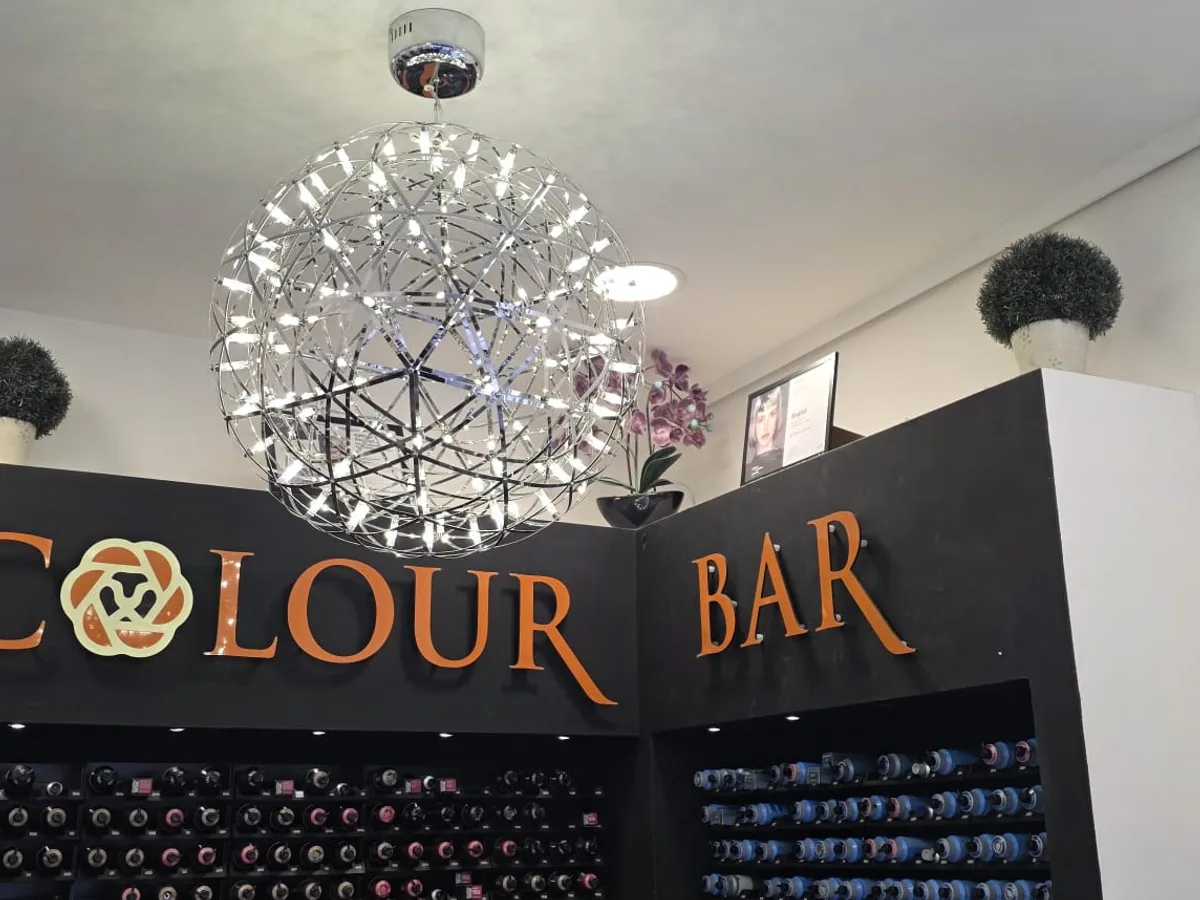 Starburst feature pendant light installed over the Colour Bar at Roar Hair and Beauty