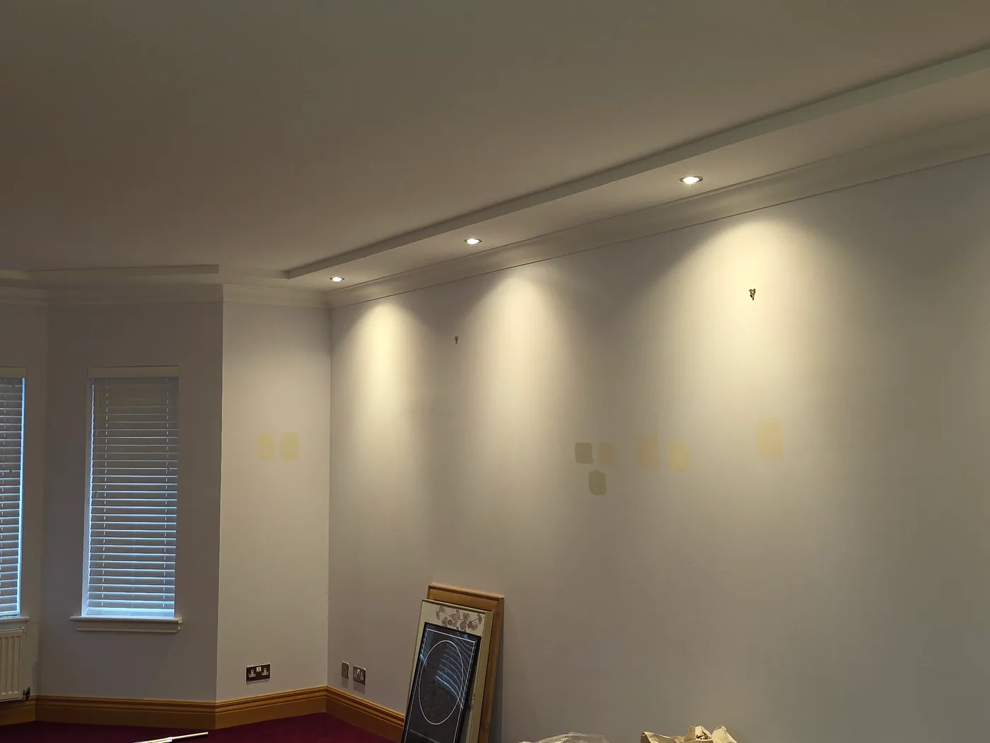 Warm LED downlights washing down a modern room