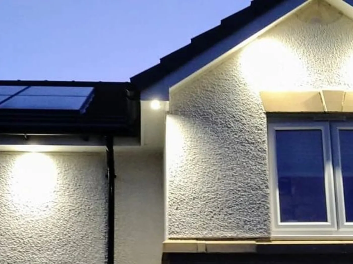 Exterior lighting on a property at dusk